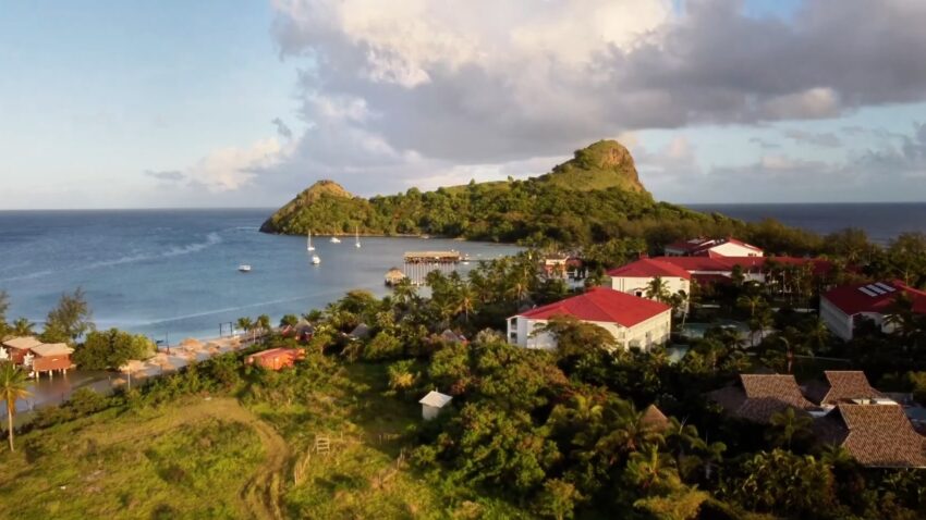 Aerial view of a coastal village and bay in St. Lucia