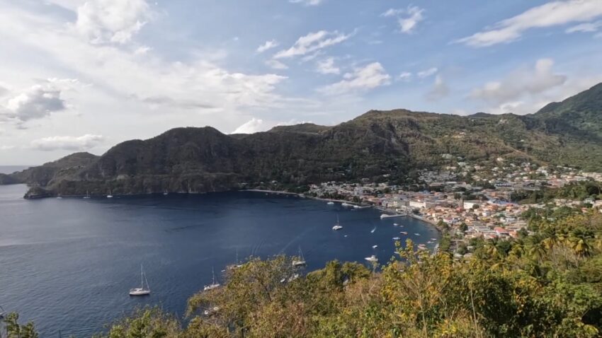 Coastal town and harbor view in St. Lucia with homes along the waterfront