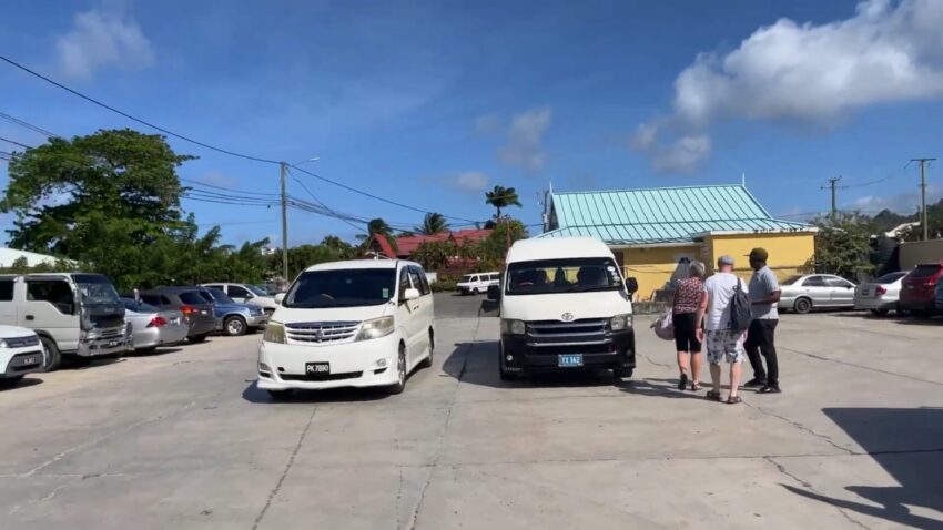 Passengers board a local minibus during daily travel in St. Lucia
