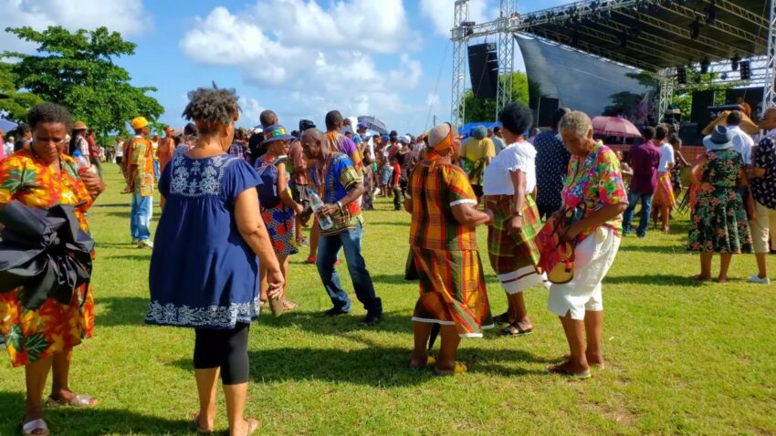 People dance in traditional clothing during a Jounen Kwéyòl festival celebration